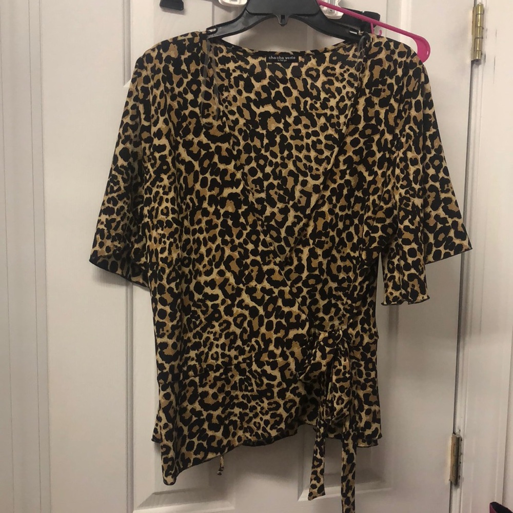 NWOT cheetah wrap front peplum top